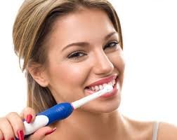 Dentist examining patient's teeth during an oral hygiene check-up.